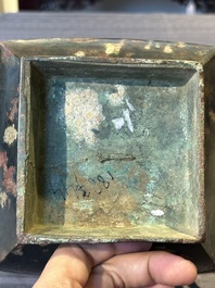 A Chinese archaic bronze vase with 'Taotie' handles, 'fang hu 方壺', Han