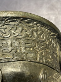 A Chinese bronze 'elephant' tripod censer and cover, Ming