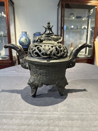 A Chinese bronze 'elephant' tripod censer and cover, Ming