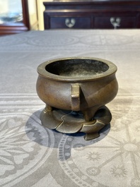 A Chinese bronze censer and stand, Xuande mark, 17th C.