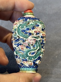 Five Chinese moulded famille rose snuff bottles, Qianlong mark, 19th C.