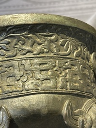 A Chinese bronze 'elephant' tripod censer and cover, Ming
