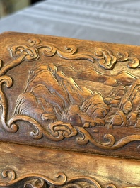 A Chinese Huanghuali wood coffin-shaped offering box and cover with mountainous landscape design, 17/18th C.