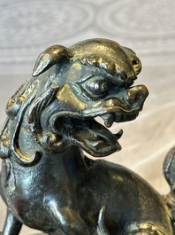 A large Chinese bronze censer and cover with a Buddhist lion, Ming