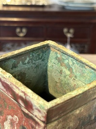 A Chinese archaic bronze vase with 'Taotie' handles, 'fang hu 方壺', Han