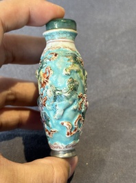 Five Chinese moulded famille rose snuff bottles, Qianlong mark, 19th C.