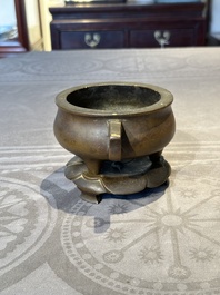 A Chinese bronze censer and stand, Xuande mark, 17th C.