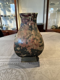 A Chinese archaic bronze vase with 'Taotie' handles, 'fang hu 方壺', Han