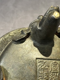 A Chinese bronze 'elephant' tripod censer and cover, Ming