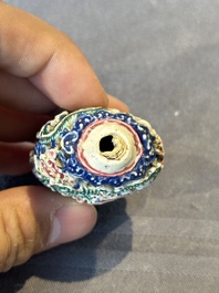 Five Chinese moulded famille rose snuff bottles, Qianlong mark, 19th C.