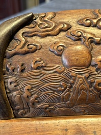 A Chinese Huanghuali wood coffin-shaped offering box and cover with mountainous landscape design, 17/18th C.