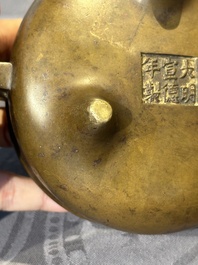 A Chinese bronze censer and stand, Xuande mark, 17th C.