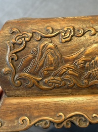 A Chinese Huanghuali wood coffin-shaped offering box and cover with mountainous landscape design, 17/18th C.