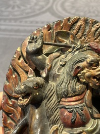 A Chinese bronze Guanyin, Ming and a Tibetan polychrome plaster relief, 19th C.