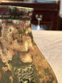 A Chinese archaic bronze vase with 'Taotie' handles, 'fang hu 方壺', Han