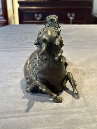 A fine Chinese bronze 'qilin' censer and cover, Ming