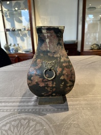 A Chinese archaic bronze vase with 'Taotie' handles, 'fang hu 方壺', Han