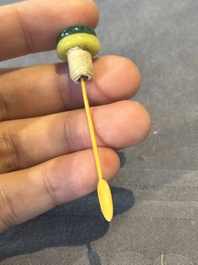 Five Chinese moulded famille rose snuff bottles, Qianlong mark, 19th C.