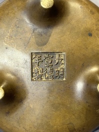 A Chinese bronze censer and stand, Xuande mark, 17th C.