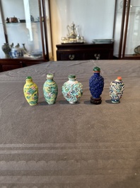 Five Chinese moulded famille rose snuff bottles, Qianlong mark, 19th C.