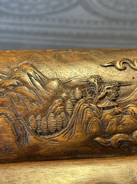 A Chinese Huanghuali wood coffin-shaped offering box and cover with mountainous landscape design, 17/18th C.