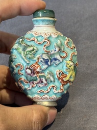 Five Chinese moulded famille rose snuff bottles, Qianlong mark, 19th C.