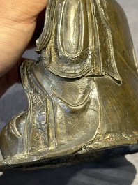 A Chinese bronze Guanyin, Ming and a Tibetan polychrome plaster relief, 19th C.