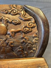 A Chinese Huanghuali wood coffin-shaped offering box and cover with mountainous landscape design, 17/18th C.