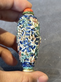 Five Chinese moulded famille rose snuff bottles, Qianlong mark, 19th C.