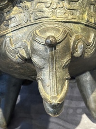 A Chinese bronze 'elephant' tripod censer and cover, Ming