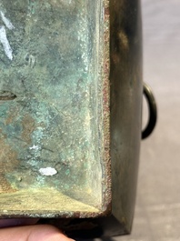 A Chinese archaic bronze vase with 'Taotie' handles, 'fang hu 方壺', Han