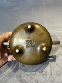 A Chinese bronze censer and stand, Xuande mark, 17th C.