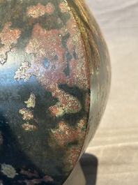 A Chinese archaic bronze vase with 'Taotie' handles, 'fang hu 方壺', Han