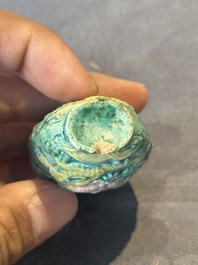 Five Chinese moulded famille rose snuff bottles, Qianlong mark, 19th C.