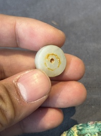 Five Chinese moulded famille rose snuff bottles, Qianlong mark, 19th C.