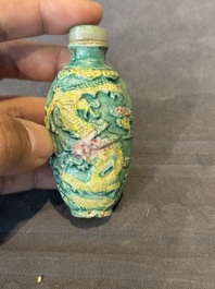 Five Chinese moulded famille rose snuff bottles, Qianlong mark, 19th C.