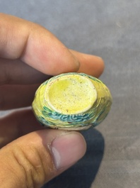 Five Chinese moulded famille rose snuff bottles, Qianlong mark, 19th C.