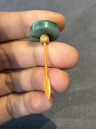 Five Chinese moulded famille rose snuff bottles, Qianlong mark, 19th C.