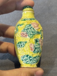 Five Chinese moulded famille rose snuff bottles, Qianlong mark, 19th C.