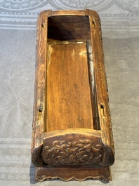 A Chinese Huanghuali wood coffin-shaped offering box and cover with mountainous landscape design, 17/18th C.