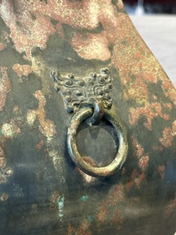 A Chinese archaic bronze vase with 'Taotie' handles, 'fang hu 方壺', Han