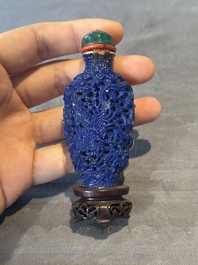 Five Chinese moulded famille rose snuff bottles, Qianlong mark, 19th C.