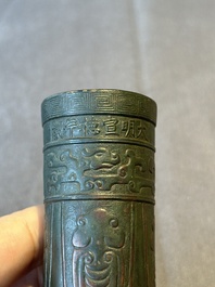 A Chinese bronze cylindrical 'cicada' flower arranging vase, Xuande mark, Ming