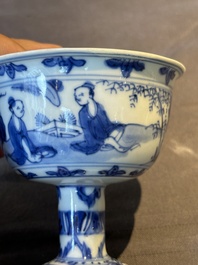 A Chinese blue and white stem cup with scholars in a landscape, Transitional period