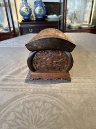 A Chinese Huanghuali wood coffin-shaped offering box and cover with mountainous landscape design, 17/18th C.