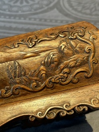 A Chinese Huanghuali wood coffin-shaped offering box and cover with mountainous landscape design, 17/18th C.