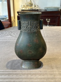 A Chinese silver-inlaid bronze arrow vase with Taotie design, 'touhu 投壺', Ming