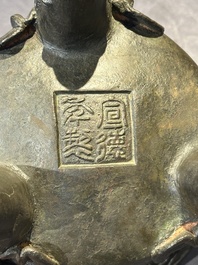 A Chinese bronze 'elephant' tripod censer and cover, Ming
