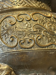 A large Chinese bronze censer and cover with a Buddhist lion, Ming