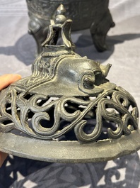 A Chinese bronze 'elephant' tripod censer and cover, Ming